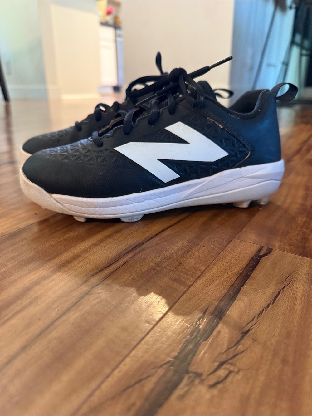 New Balance kids size 4 wide baseball cleats